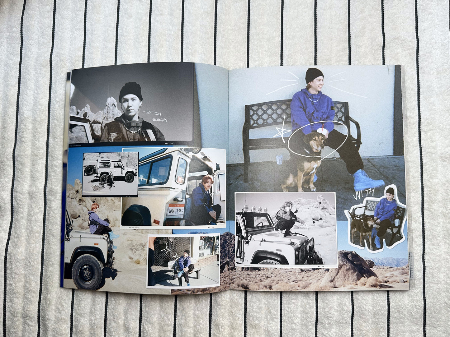 Open photo album with images of people and vehicles on a wooden surface