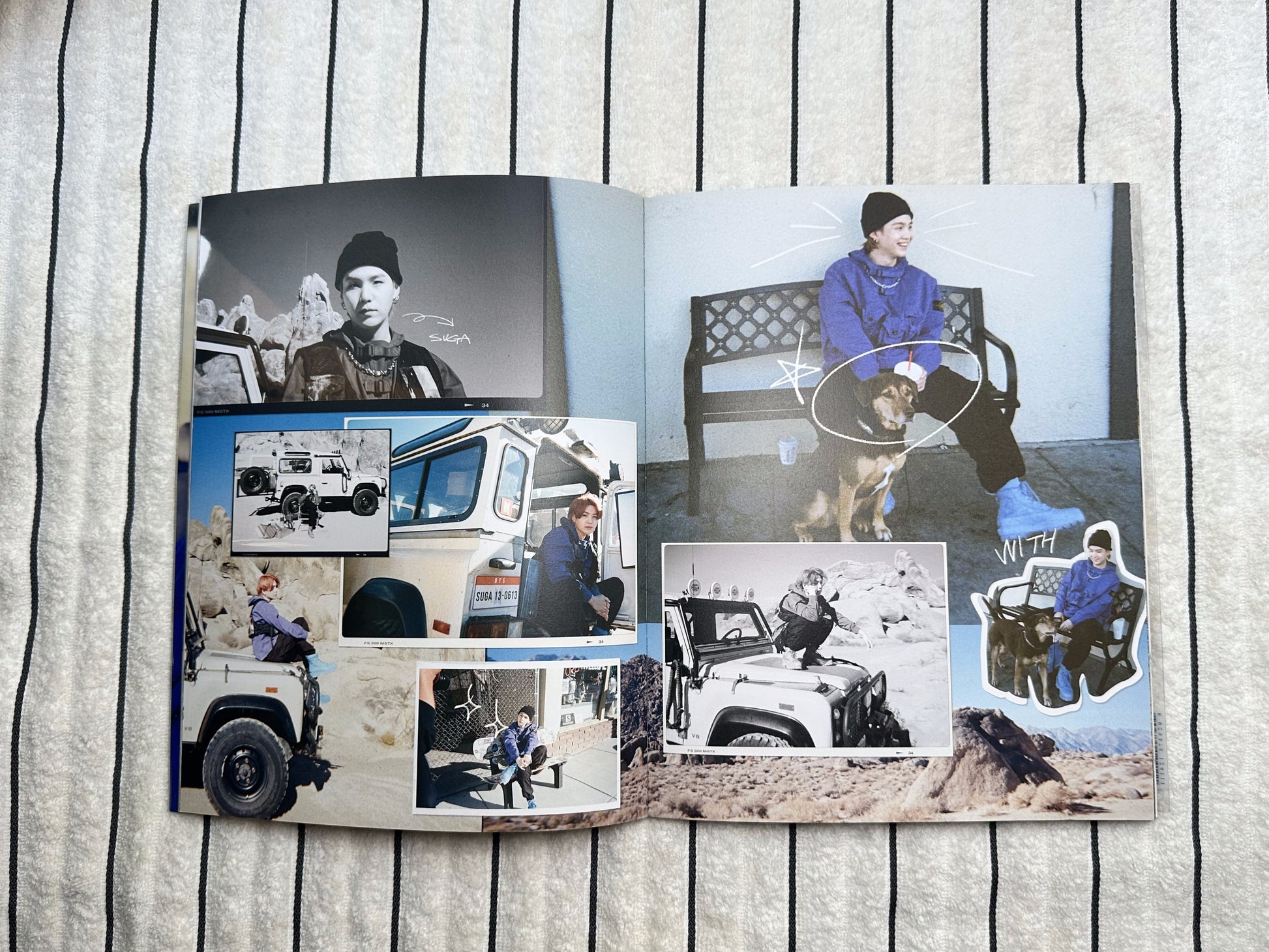 Open photo album with images of people and vehicles on a wooden surface